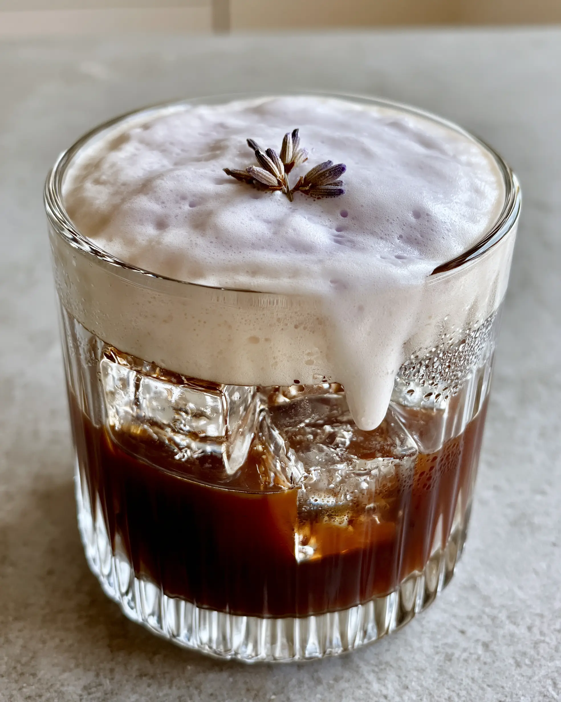 Lavender Cold Foam: The Ultimate Floral Upgrade for Your Morning Brew 3 Top view of pastel-purple Lavender Cold Foam with micro-bubbles and dried lavender garnish.