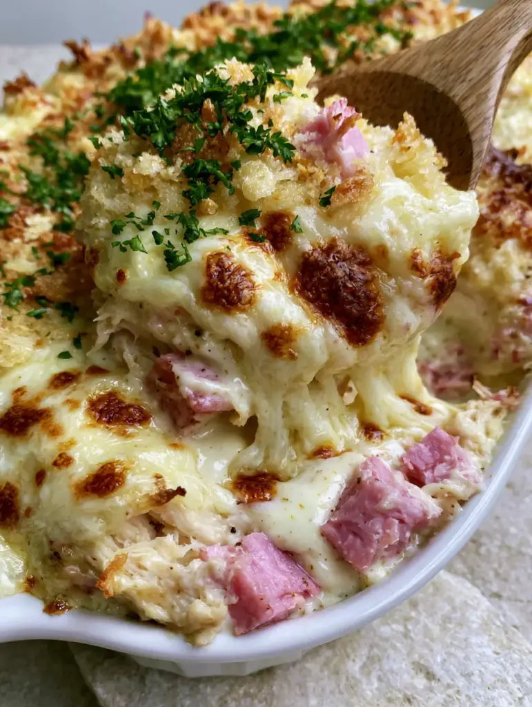 Chicken Cordon Bleu Recipe: The Ultimate Creamy Casserole with a Crispy Panko Crust 1 High-resolution shot of toasted panko breadcrumbs and fresh parsley garnish on a creamy casserole. (Chicken Cordon Bleu recipe)